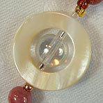 White Saturn composed of crystal center with mother of pearl ring